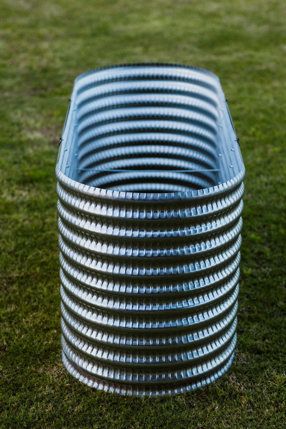 A Plaaslik corrugated steel raised garden bed set up on a balcony