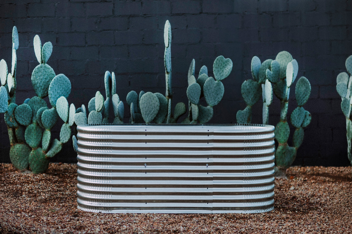 A Plaaslik corrugated steel raised garden bed set up on a balcony